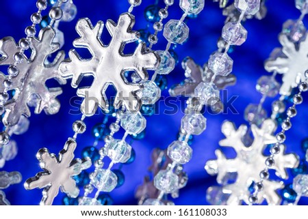 Glittery snowflakes on dark blue background