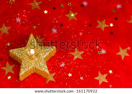 Red winter background with star candle