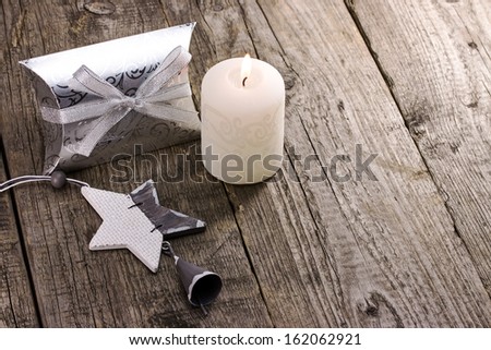 Christmas gift box with candle and star