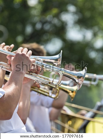 Street performers playing popular music on the trumpet
