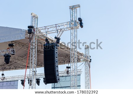 Setting up a stage lighting and sound equipment before the concert