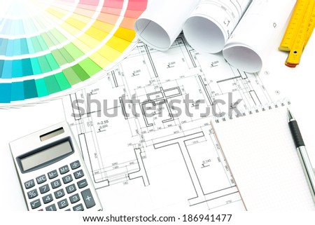 Architect's and designer's work space during work with technical drawing and color samples