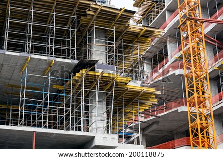 Modern high-rise apartment construction site with scaffolding
