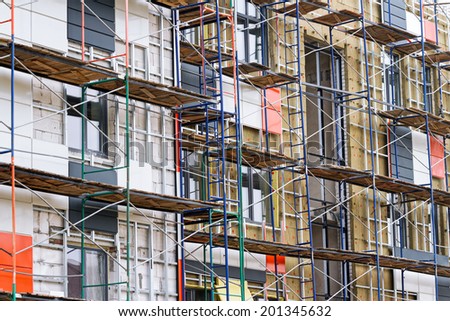 Apartment construction in the process of being built with metal scaffolding