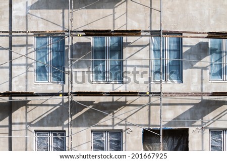 Scaffolding on a building facade used for renovation and construction
