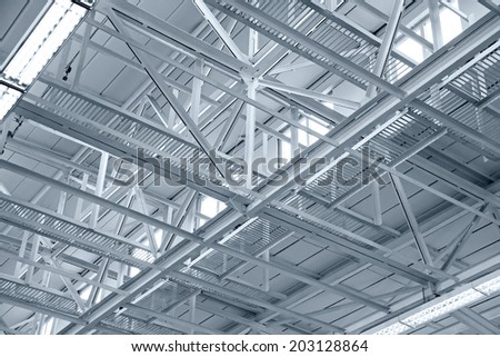Industrial factory ceiling with roof beam and lights