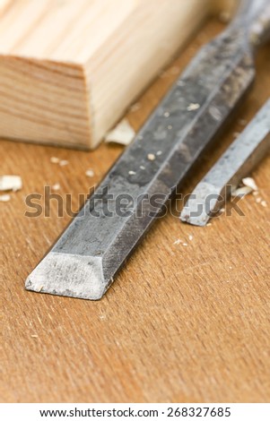 Used carpenter wood chisels tool with planks and shavings