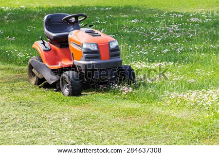 Lawn mower and cut green grass