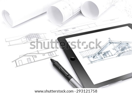 tablet computer with drawing, stylus and house plan blueprints