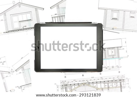 architectural background with blank digital tablet over blueprints