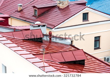new red metal tiled roofs with chimneys and dormer windows