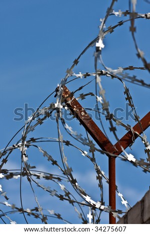 A barbed wire fence with razor sharp wires