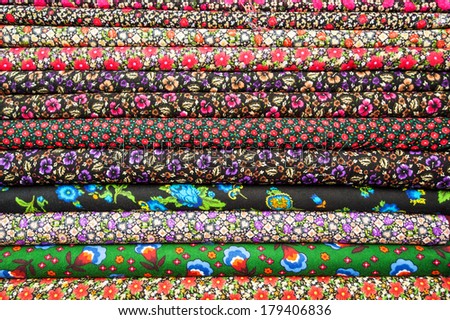 Turkish textiles and fabrics of different colors in the stack
