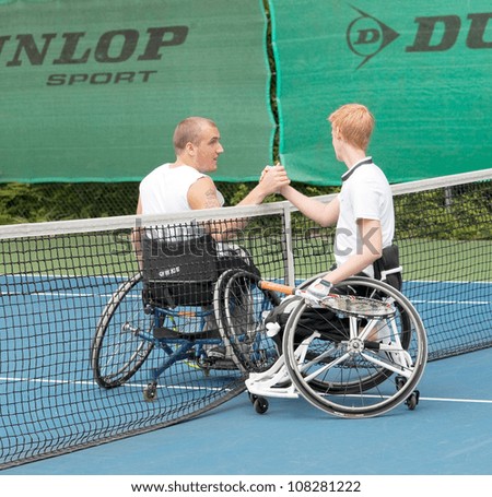 AMSTERDAM - JULY 21: Unidentified athletes participate in Amsterdam Open Wheelchair Tennis competition, held on July 21, 2012 in Amsterdam,The Netherlands