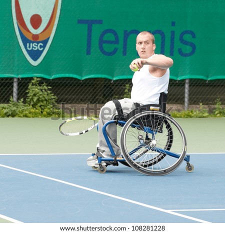 AMSTERDAM - JULY 21: Unidentified athlete participates in Amsterdam Open Wheelchair Tennis competition, held on July 21, 2012 in Amsterdam,The Netherlands