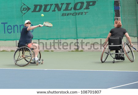 AMSTERDAM - JULY 21: Unidentified athletes participate in Amsterdam Open Wheelchair Tennis competition, held on July 21, 2012 in Amsterdam,The Netherlands