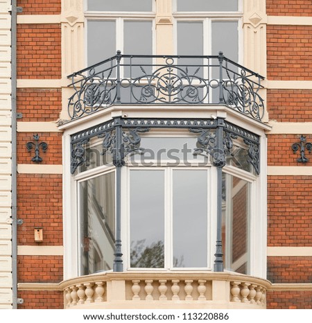 Bay window of an early 1900s building in Amsterdam, the Netherlands, as an example of Dutch vintage urban architecture