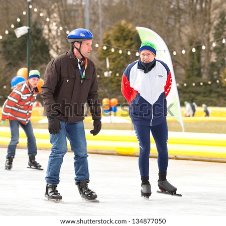 AMSTERDAM - MAR 24: Unidentified city natives participate in the annual KPN Skating Friends Day, organized by the Dutch Foundation for Disability Sport, March 24, 2013, in Amsterdam, The Netherlands