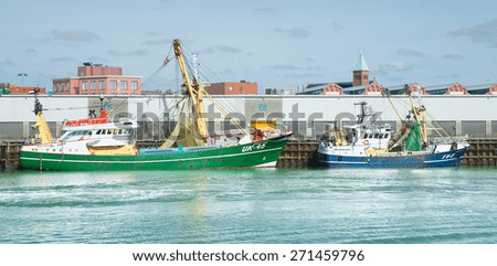 IJMUIDEN, THE NETHERLANDS - MARCH 22, 2015: Fishing vessels are moored in the harbor of IJmuiden. IJmuiden is the largest fishing port of the Netherlands.