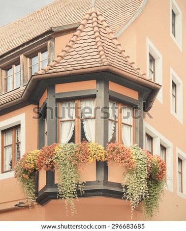 Bay window on a traditional vintage German house. Toned filtered image in a retro nostalgic style.