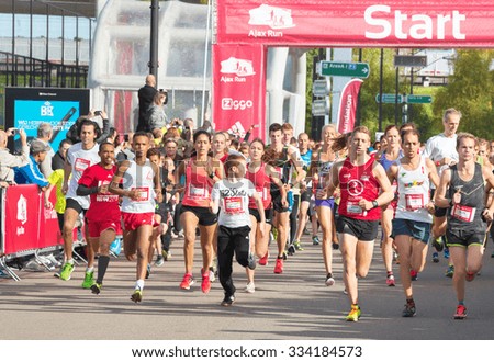 AMSTERDAM, THE NETHERLANDS - OCTOBER 25, 2015: Participants of Ajax Run start a 5 km race. Ajax Run is a public non-ticketed running event for recreational athletes, held in the city's streets