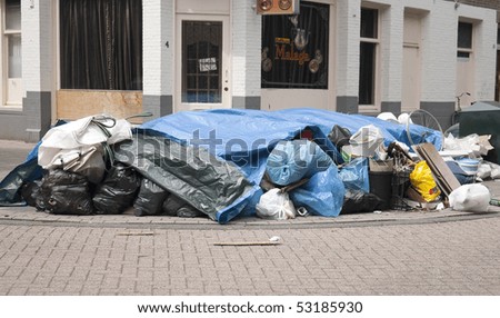 AMSTERDAM, THE NETHERLANDS - MAY 16: Week-long garbage men strike afflicts the city, May 16, 2010 in Amsterdam, The Netherlands