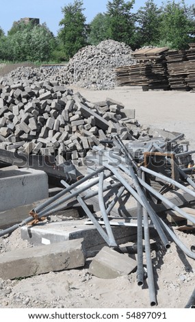 Construction site with building materials, stored outside