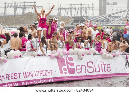 AMSTERDAM - AUG 6: Members and friends of Utrecht\'s gay community on board of boat participate in the Canal Parade, held during Amsterdam Gay Pride week, August 6, 2011, Amsterdam, The Netherlands