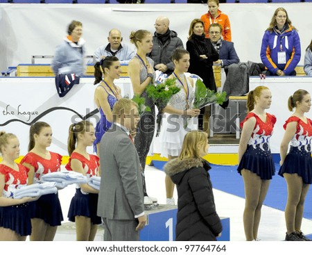 THE HAGUE - MARCH 10: Medalists (l-r) Valentina Marchei, Carolina Kostner, Alissa Czisny during the medal ceremony at Challenge Cup for figure skating, on March 10, 2012 in The Hague, the Netherlands