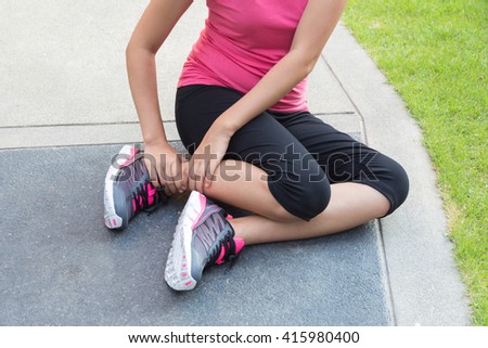 Sporty woman get hurt with twisted ankle.