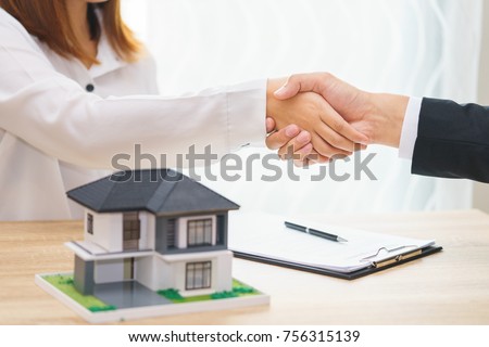 Customer or woman say yes to sign loan contract for buying new home concept - hand shaking