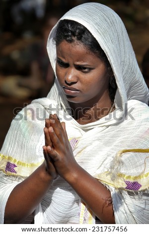 TURMI, ETHIOPIA - NOVEMBER 22, 2011: The woman prays during celebration in orthodox church. November 22, 2011 in Turmi, Ethiopia.