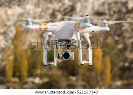 Rotating drone on background of mountains / Drone in the air