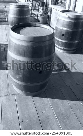 Vintage style barrels against a wall in la spezia