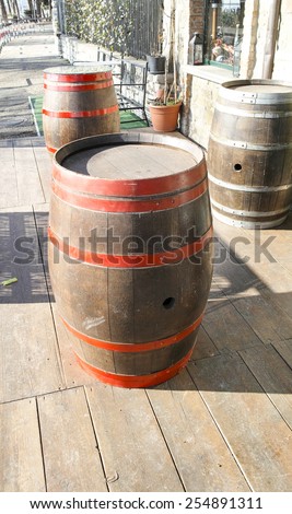 Vintage style barrels against a wall in la spezia