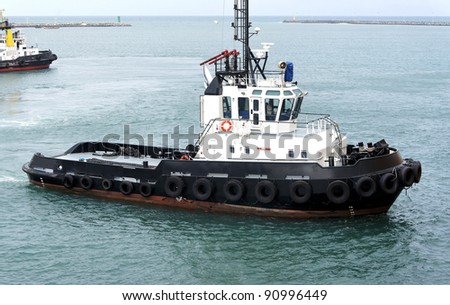 isolated tug boat in lome\' port