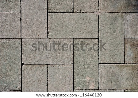 Rough textured concrete tiles walkway closeup background