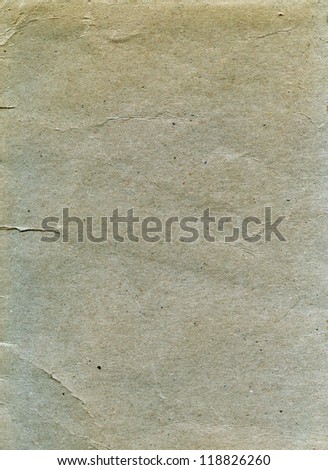 Textured grainy aged recycled paper with natural fiber parts