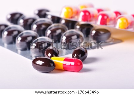 Pills and capsules, defocused pills blister background