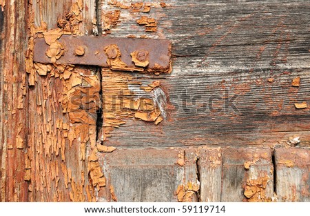 Closeup image of weathered obsolete painted door