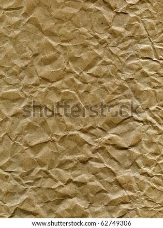 Textured obsolete crumpled packaging brown paper background