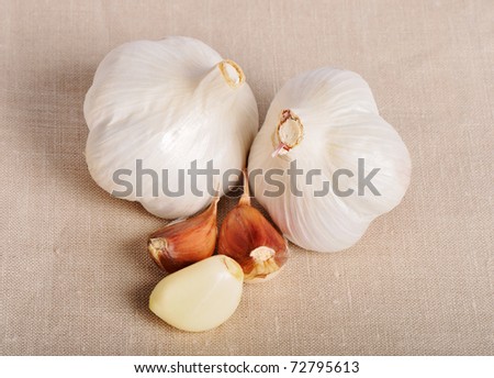 stock photo Full fresh garlic on linen background wedding linen backgrounds