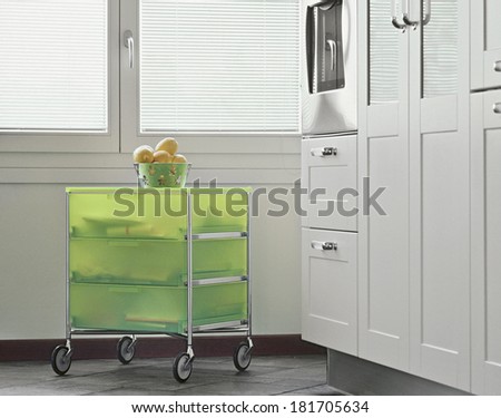 green modern fruit trolley in the modern kitchen