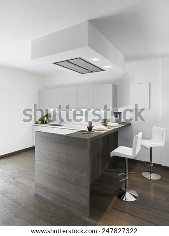 interior view of modern kitchen with wood floor and kitchen island