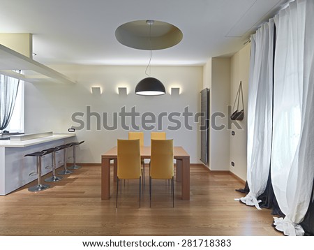 modern dining room with yellow leather chairs and wooden table, floor nade of parquet.