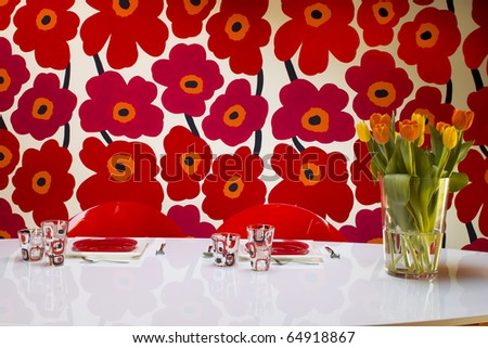 vase of tulips and dishes  on the table