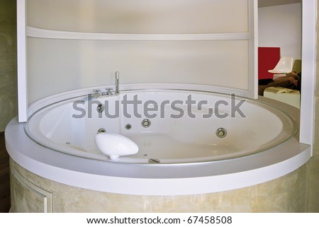 modern Hydro-massage bathtub round in the room
