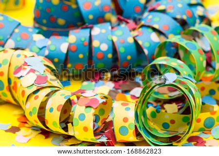 Bright, colorful party streamers and confetti.