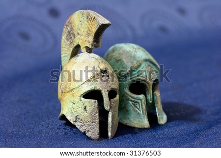 Ancient Greek helmet on a blue background