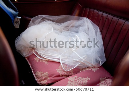 Detail of white wedding veil with headdress